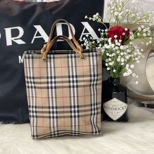 BURBERRY LEATHER HANDLE PLAID CHECKERED TOTE HANDBAG. IT HAS TINY DARK SPOTS.